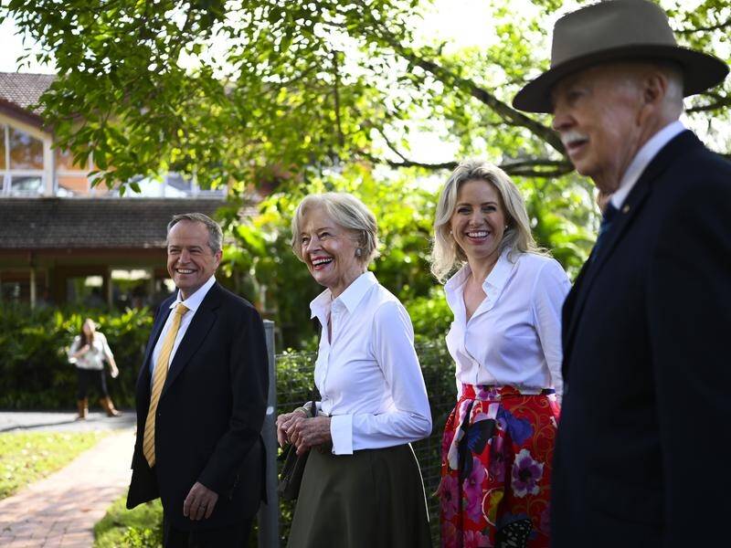 Bill Shorten and former Governor-General Quentin Bryce arrive with family for an Easter service.