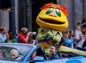 Marty Krofft and his character HR Pufnstuf took part in a parade in Atlanta in September. (EPA PHOTO)