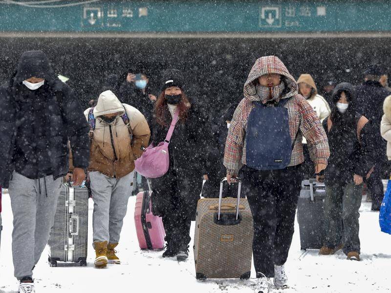 Severe weather across China has disrupted the New Year plans for thousands of travellers. (AP PHOTO)