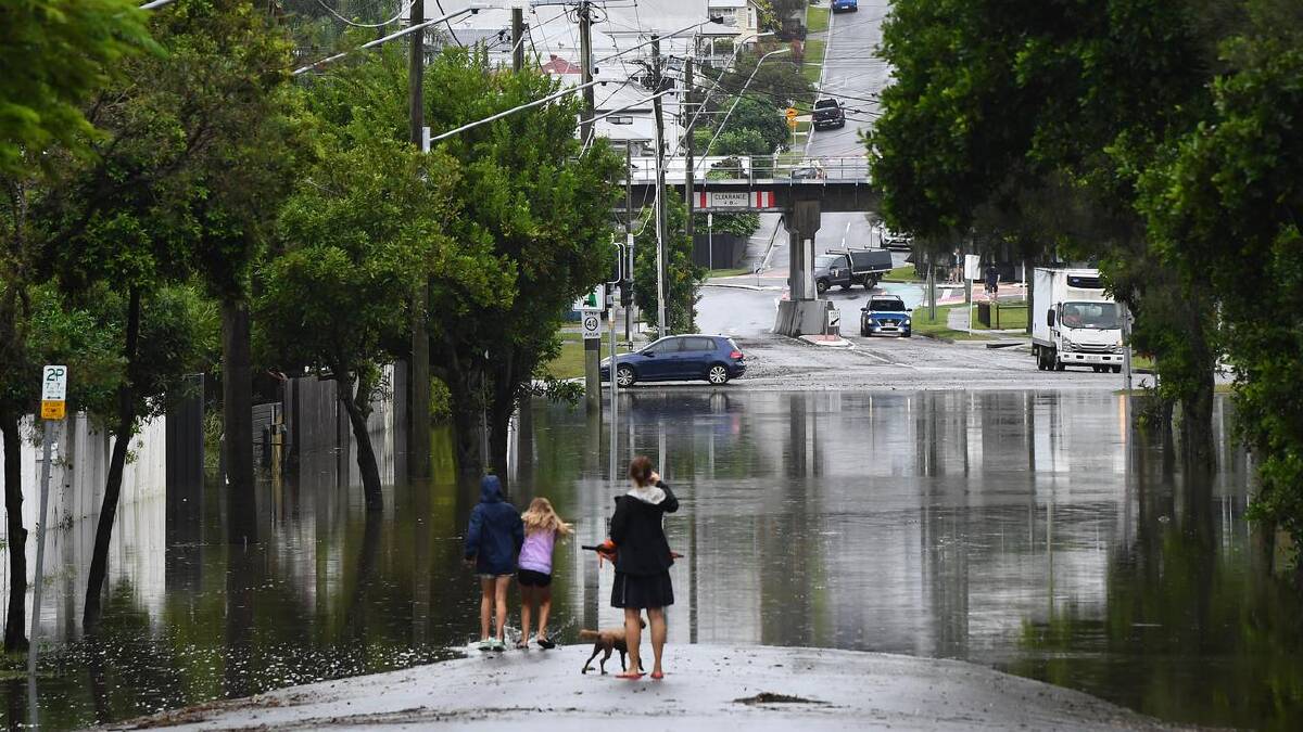 Residents west of Brisbane were told to "take safe shelter" as creeks rose. (Jono Searle/AAP PHOTOS) Residents west of Brisbane were told to "take safe shelter" as creeks rose. (Jono Searle/AAP PHOTOS)