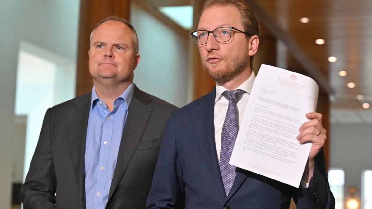 Coalition frontbenchers Ted O'Brien (left) and James Paterson call for a police probe. (Mick Tsikas/AAP PHOTOS) Coalition frontbenchers Ted O'Brien (left) and James Paterson call for a police probe. (Mick Tsikas/AAP PHOTOS)