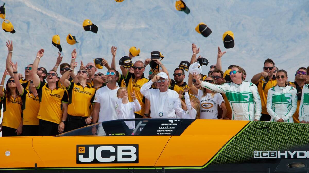 Andy Green (c) and the JCB team celebrate the new land speed record for a hydrogen-powered vehicle. (AP PHOTO)