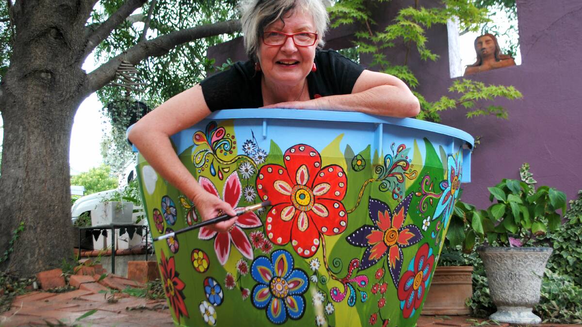 Local artist Ann Hind decorating her pot. Photo: Jessica Cole.