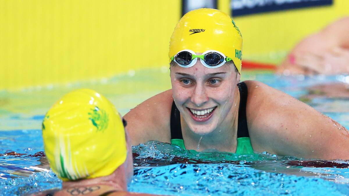 Belinda Hocking is congratulated by Emily Seebohm after her gold-medal swim in Glasgow on Sunday. Photo: Getty Images.