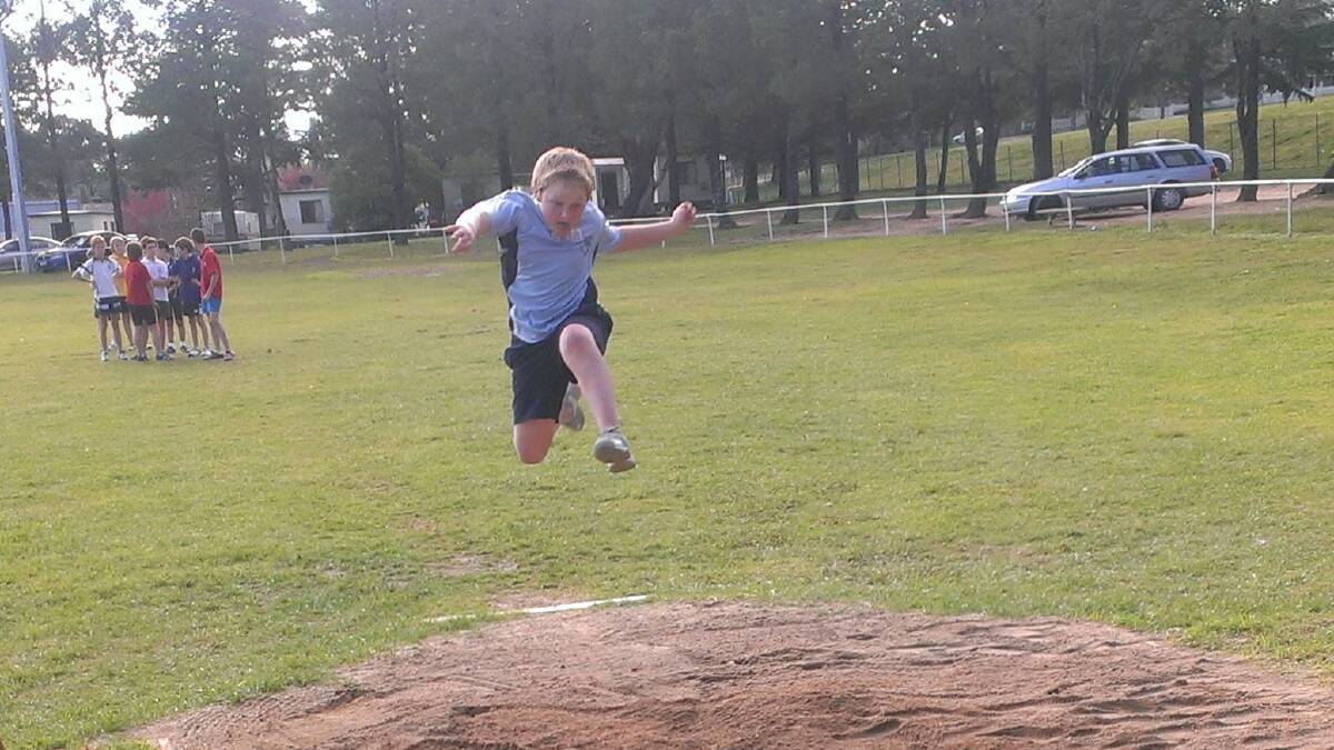 Rory Walsh of Dalton flies high in the long jump. Photo: Contributed.