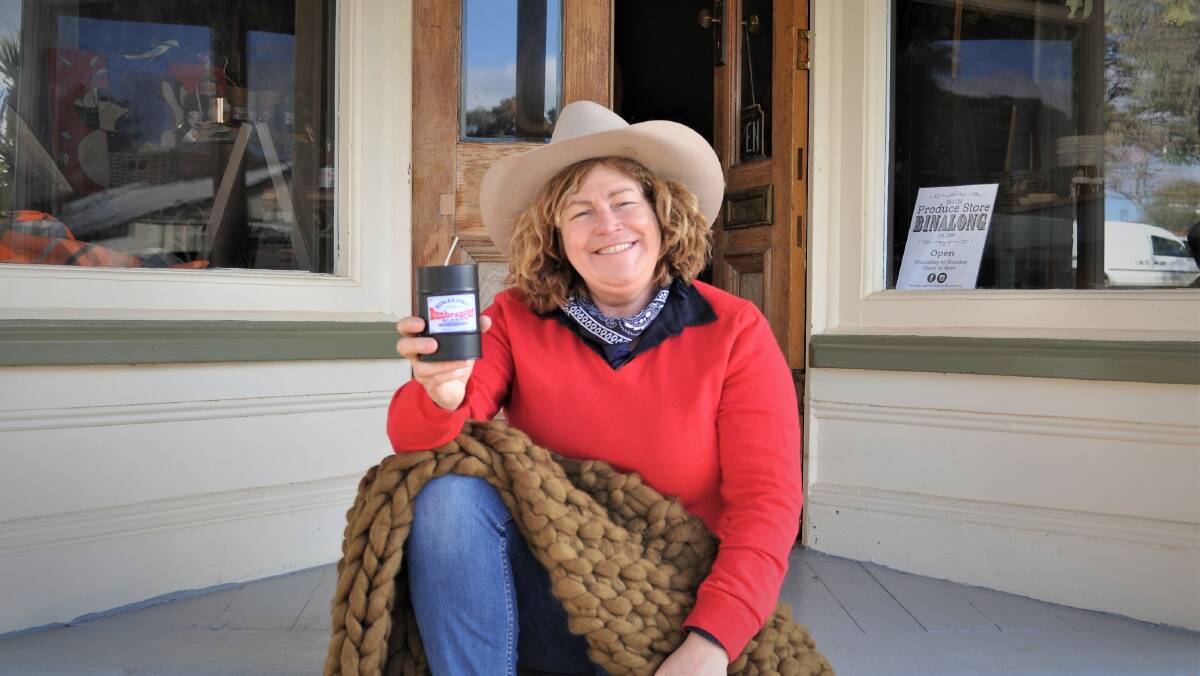 Open for business: Cathy Kerslake outside The Old Produce Store Binalong with a mandle and knitted rug available for purchase. Photo: Hannah Sparks 