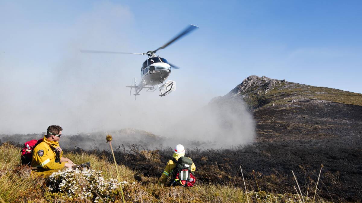 HEAT: Tasmania Fire Service crews battling the blaze at Gell River on January 8. Picture: supplied