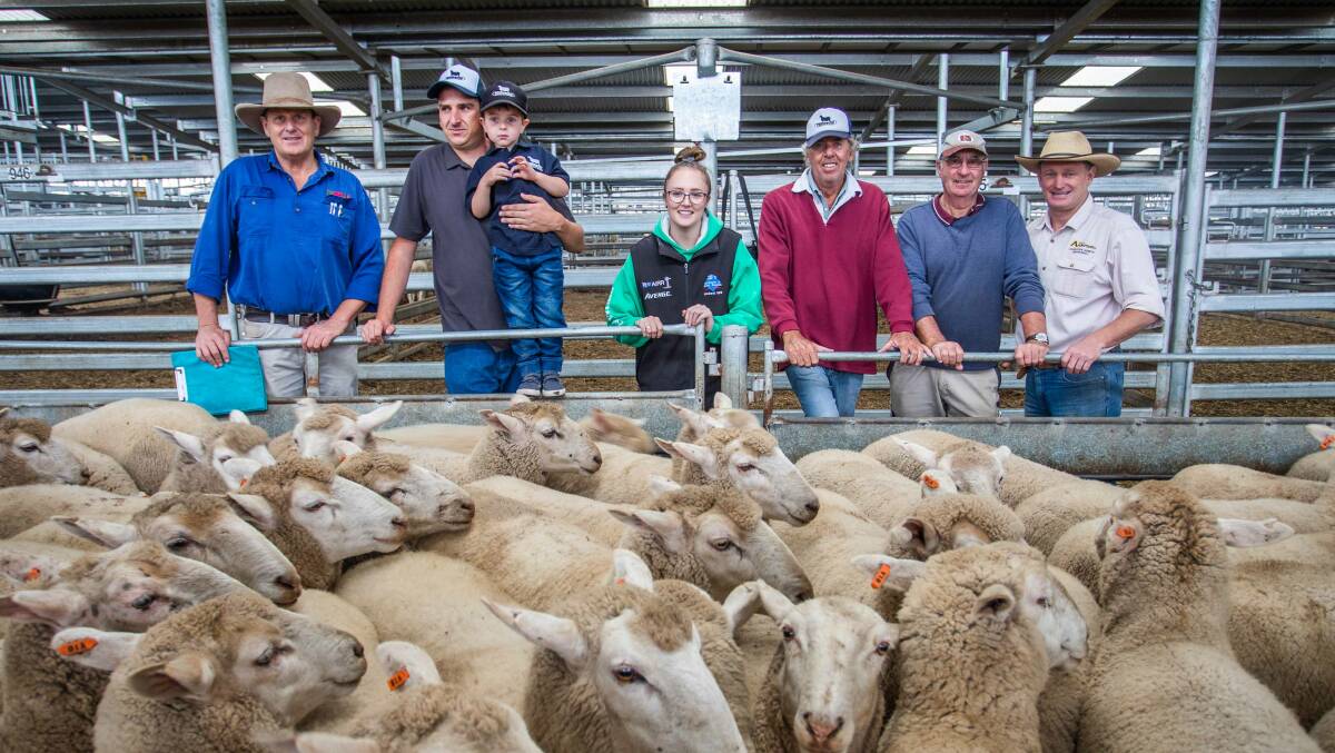 CHAMPION HIGHEST PRICED PEN OF EWES: SELX manager Rick Maslin with vendors Chris Holding with son Ryan, Gemma O'Brien and John O'Brien of Boobalaga, Crookwell; buyer Peter Southwell of Fairview, Bookham and agent Greg Anderson of MD & JJ Anderson. Photo: Heidi Grange