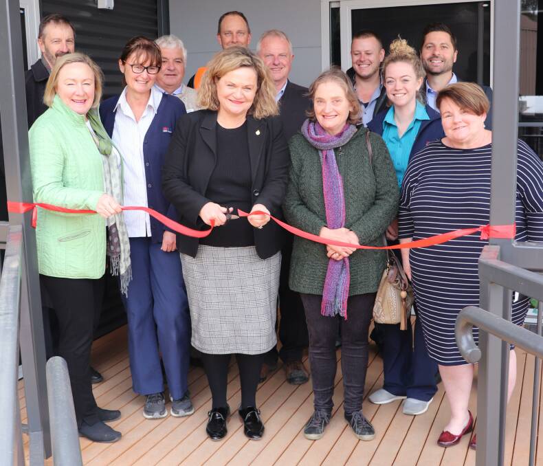 CUT THE RIBBON: Member for Goulburn Wendy Tuckerman (middle, left) and Jean Frost from the Yass Hospital Auxiliary (middle, right) open the new staff accommodation at Yass Hospital. Photo: supplied