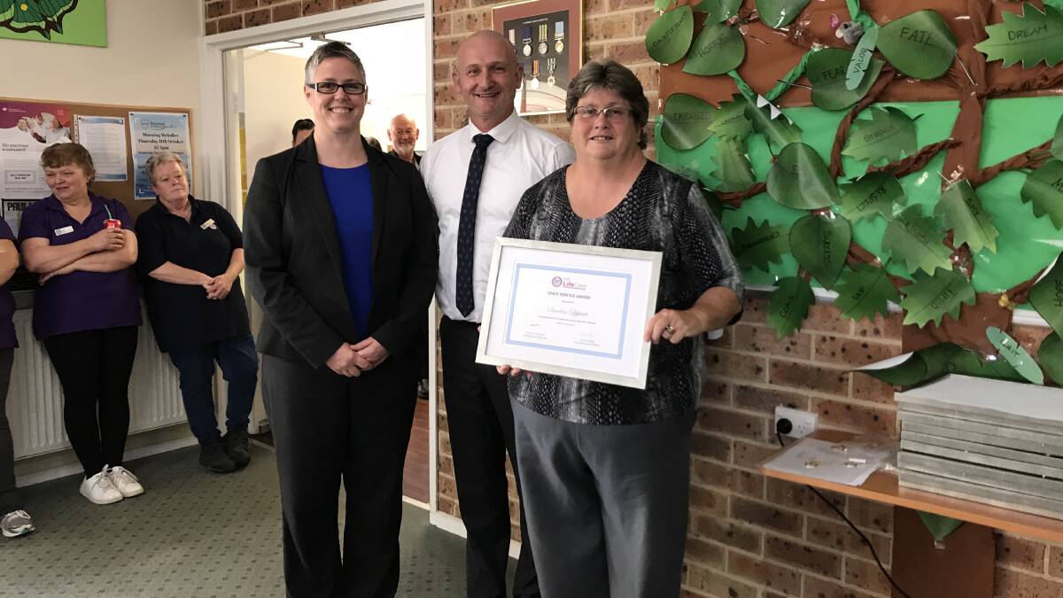 L-R: Laurie Leigh and Wayne O'Connor present Sandra Lippiatt with a certificate for 25 years of service. Picture: supplied