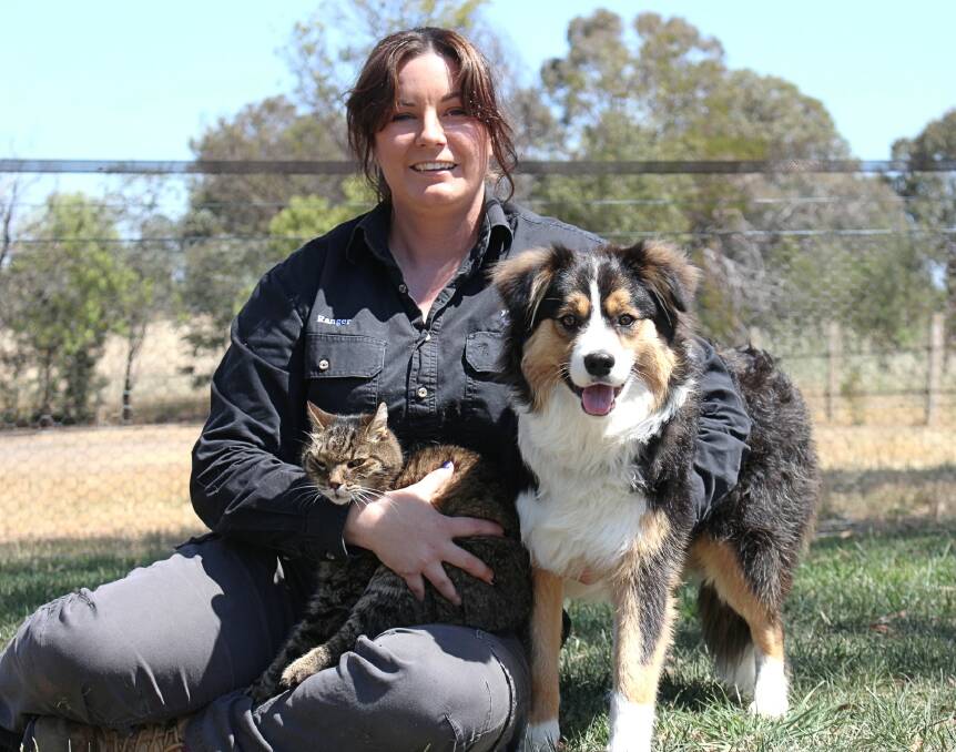 Former Yass Valley Council compliance ranger Sarah Barnes at home with her cat Jay Jay and dog Murphy. Photo: Hannah Sparks