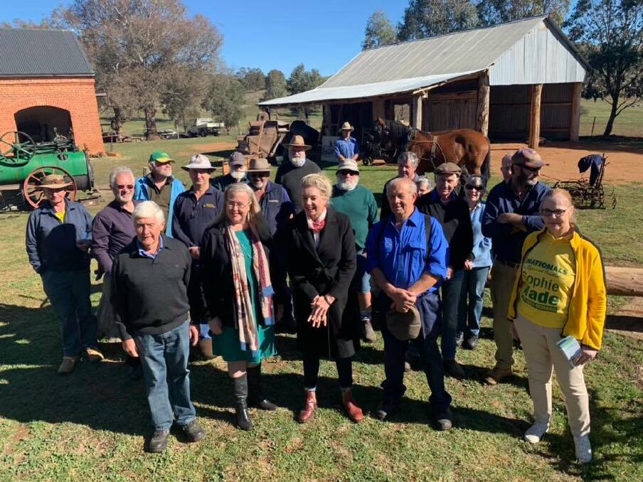 National Party candidate for Eden-Monaro Sophie Wade and deputy leader Bridget McKenzie (middle) with the Yass Antique Farm Machinery Club.