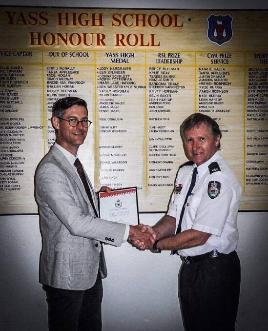NSW RFS Inspector George Shepherd presents a Certificate of Appreciation to Yass High School Deputy Principal Brendan Roberts. Photo: supplied