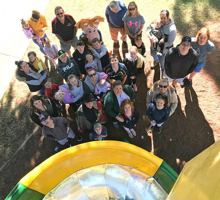 FAREWELL: Grandparents, parents, children and Yass APEX Club life member John Hedges (back, black and red shirt) farewell Coronation Park's iconic and popular miracle slide. Photo: Hannah Sparks
