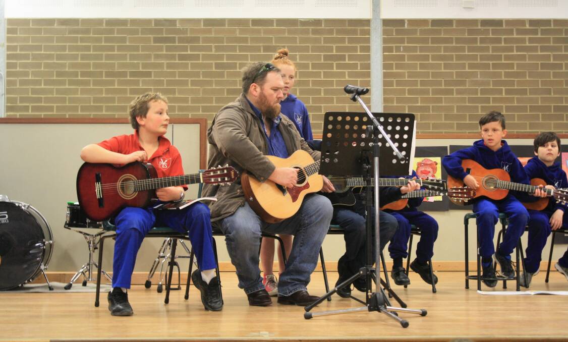 Guitar playing, singing, dancing and acting, photos from Yass Public School's Education Week concert