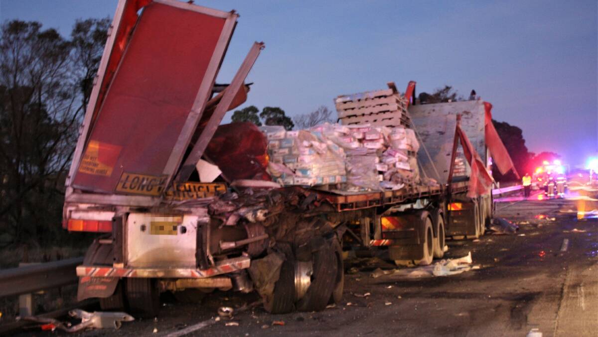 A truck carrying cement is left exposed by a fire that killed one driver.