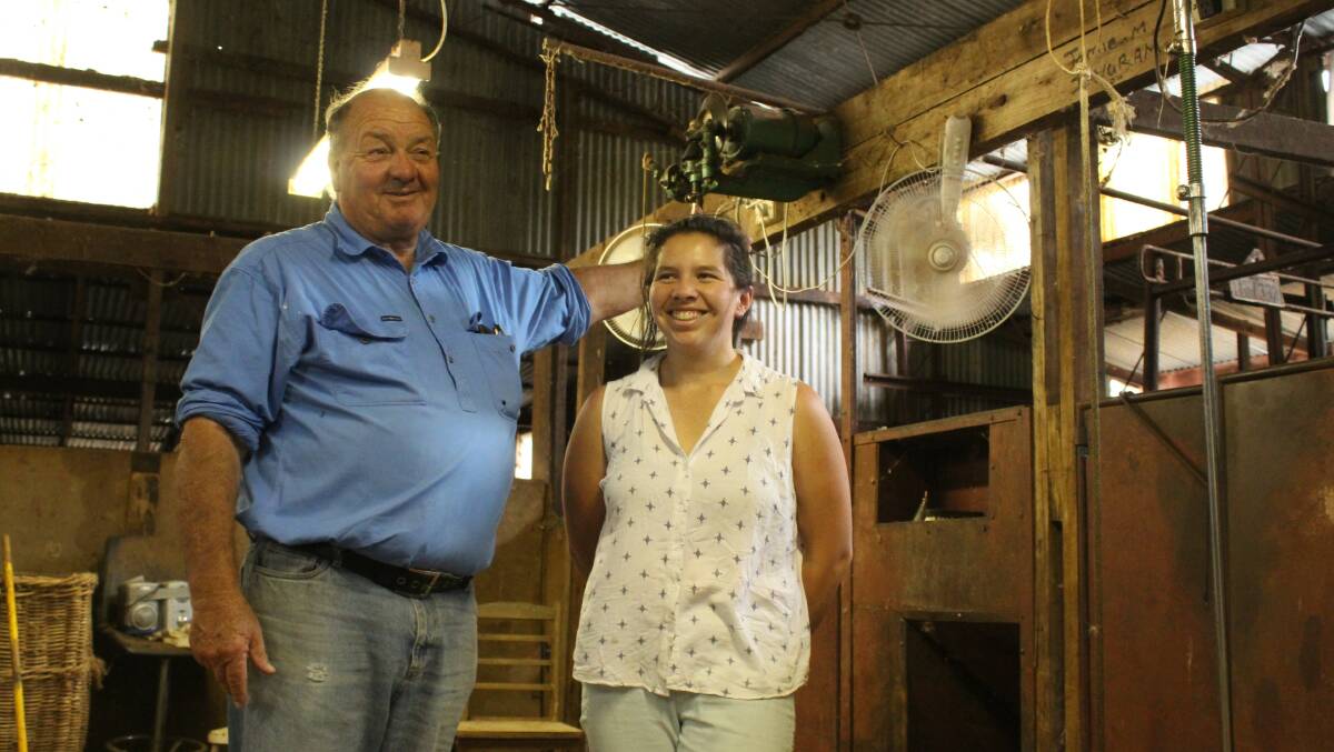 Michael and Carolina Merriman take a break from the heat under the fans in the shearing shed at Fifeshire.