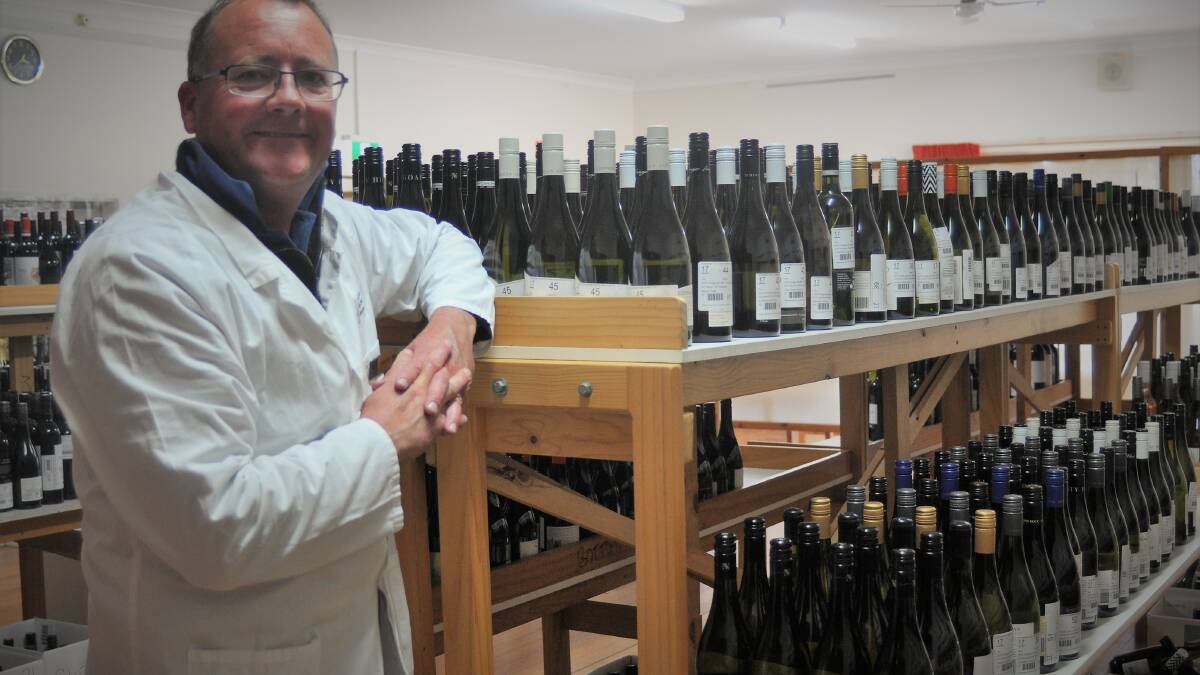 Australian Cool Climate Wine Show manager Brent Lello stands with the 2019 entries. Photo: Hannah Sparks