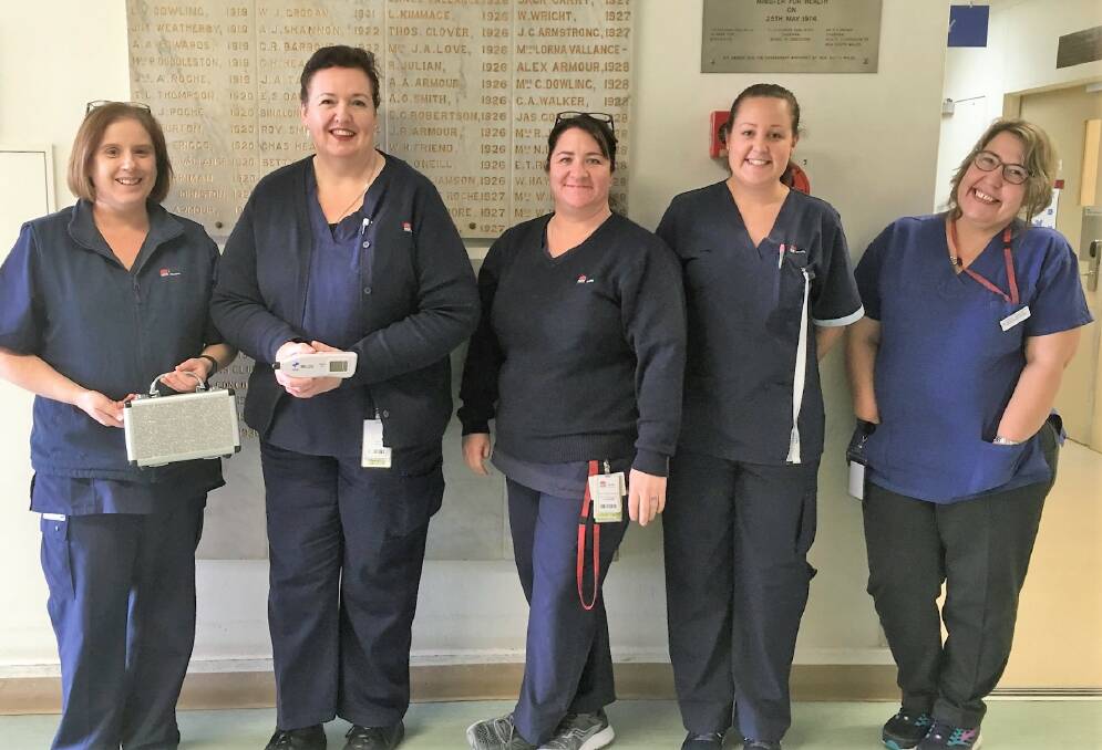 NURSES (L-R): Lyn Green, Tina Bryers, Ingrid Nasralla, Annah Witt and Tanya Barton show the new device at Yass Auxiliary Hospital. Picture: supplied