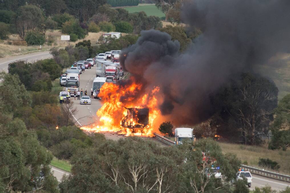 UP IN FLAMES: The truck that caught fire 1km north of the Yass Valley off ramp on the Hume Highway, in January. Photo: Andrew Hennell.