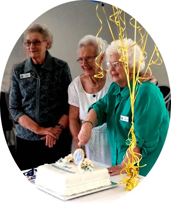 Yass Probus Life Members: Lyn Butt, June Comins and Lorraine Legge cut the 20-year celebration cake. Image: I D Morris