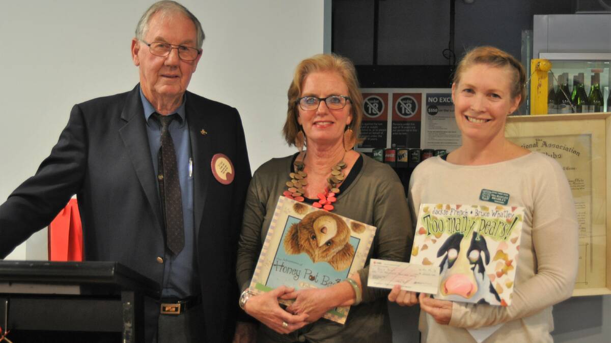 Lions Club of Yass former president Stan Luff presents the cheque for $2000 to Yass Public School principal Michelle Fahey and Berinba Public School teacher Hayley Bradley. Photo: Hannah Sparks