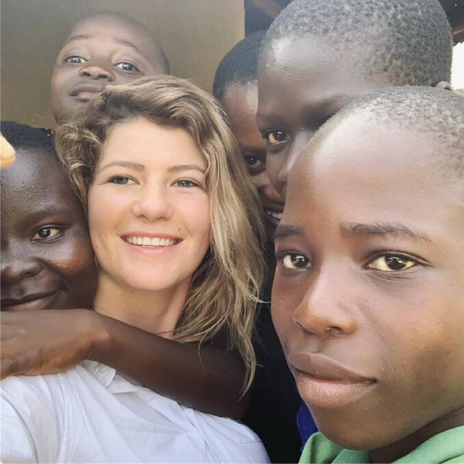 Community: Nineteen-year-old Breanna Hickey from Bevendale near Gunning plays with children living in an orphanage in Kenya. Photo: supplied by Diane Hickey
