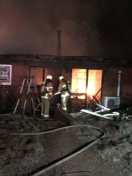 DESTROYED: Firefighters battle the blaze at a house in Murrumbateman in the early hours of Thursday morning. Photo: supplied by Fire and Rescue NSW Station Yass 511