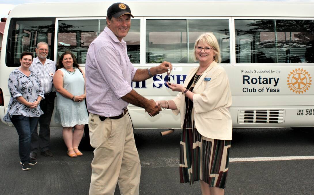 Yass Rotary president Sam Bucknell hands over the keys to the high school's principal, Linda Langton. Photo: Hannah Sparks