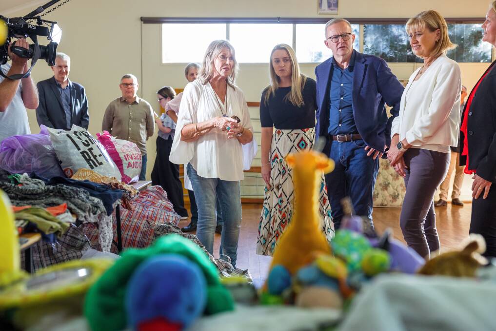 Reverend Rosemary Wynter shows Labor leader Anthony Albanese and his partner Jodie Haydon around the flood-affected church in Bangalow. Picture: Sitthixay Ditthavong