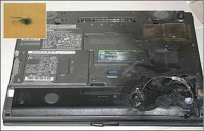 The underside of a Dell laptop which burst into flames in Singapore in 2006. Inset: the burn mark on the table top.