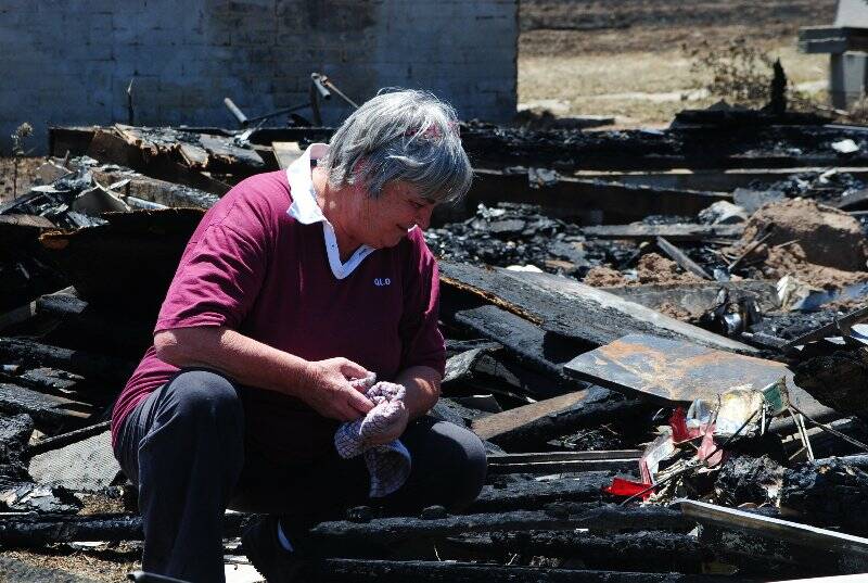 Hansie Armour assesses the damage on her property on Childowla Road. Photo: Katharyn Brine.