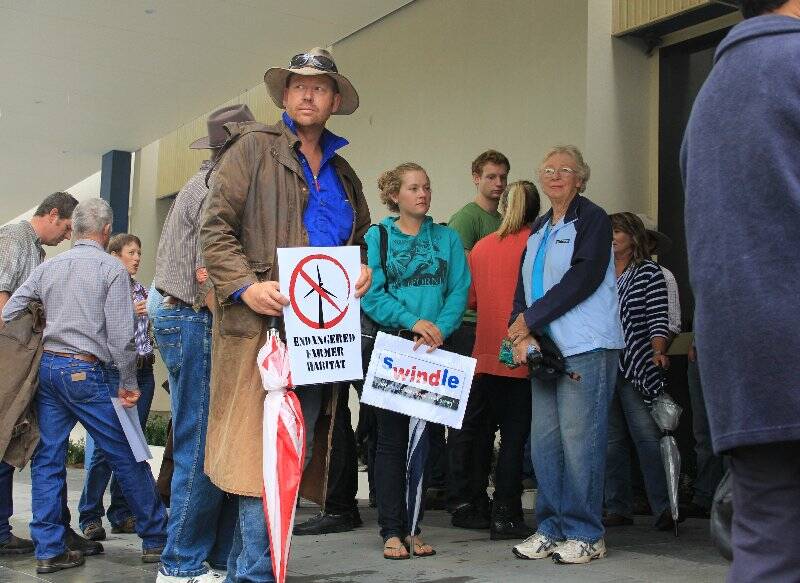 PROTEST: Bookham farmer Matt Bingley protests against the state government wind farm meeting in Yass on Thursday.