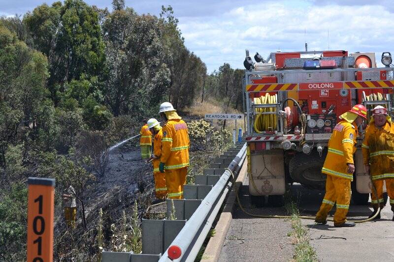 Fire fighters work to put out a fire at Manton, north east of Yass, on Wednesday.