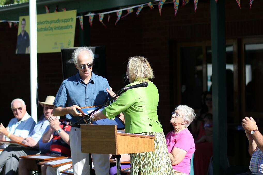 Mayor Rowena Abbey presents Kim Nelson with his award. Photo: Tiffany Grange.