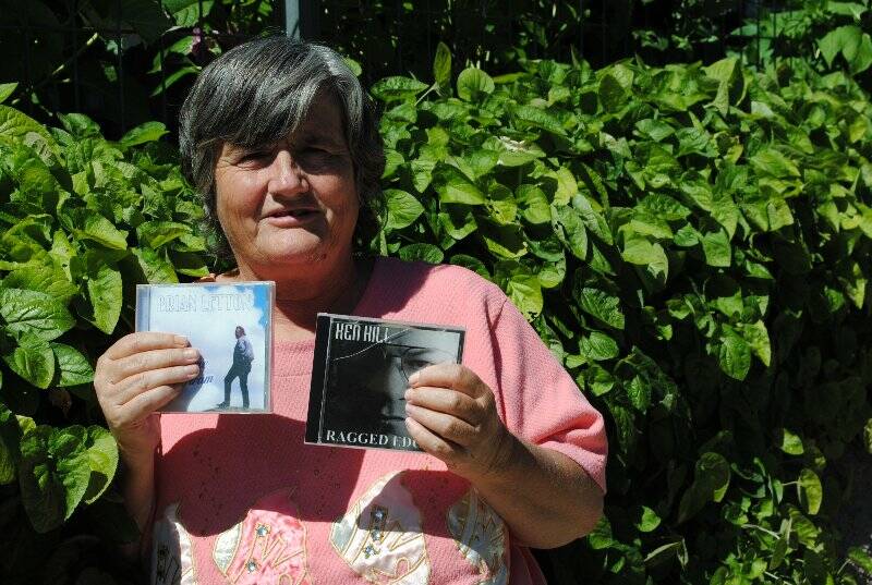 Trish Clarke in her backyard a couple of her many CD's. Photo: Oliver Watson.