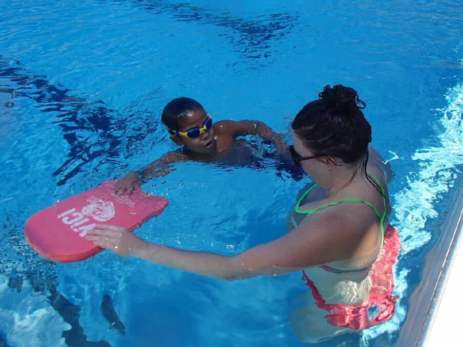 Tia Spencer and Kate Wylie teach Yarrabah locals the lifesaving skill of swimming.