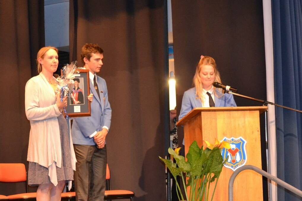 Special Guest Alison Southwell accepts her Hall of Fame Entry from School Captains, Heidi Young and Benjamin Wylie.