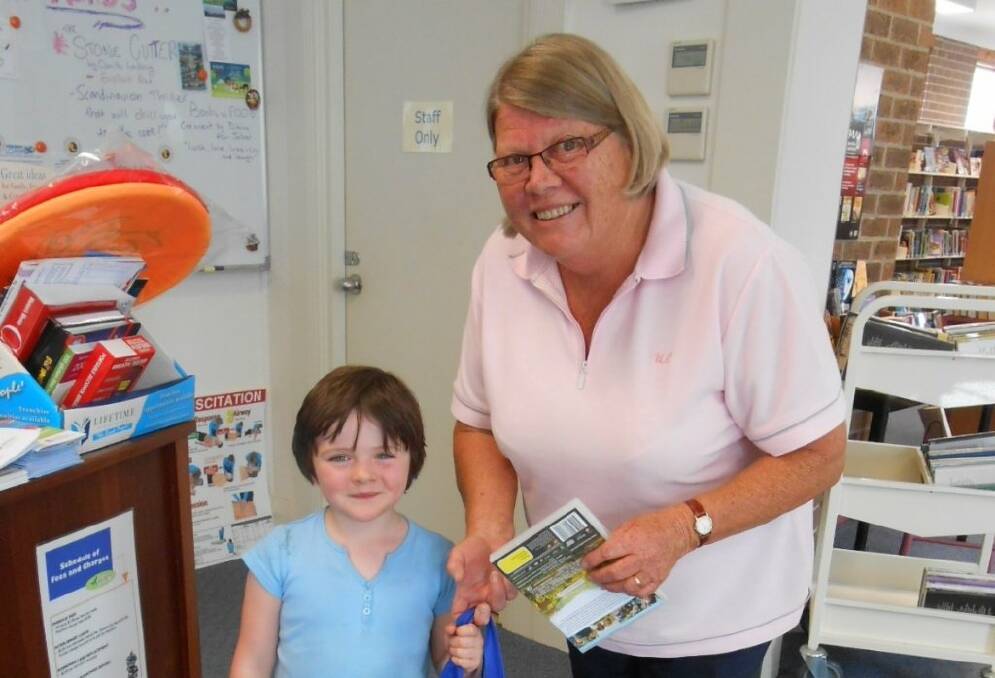 Gunning Librarian Ros medway presented pre-schooler Madeleine Hannan with her second prize in the Upper Lachlan Shire Libraries Year of Reading colouring-in competition. 