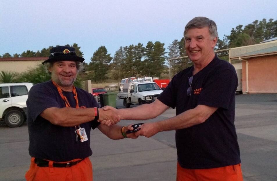 Yass SES controller Bob Buffington congratulates DAvid Mason on being appointed deputy controller. Yass SES are only a phone call away in times of strife. Photo: Jasmin Jones.