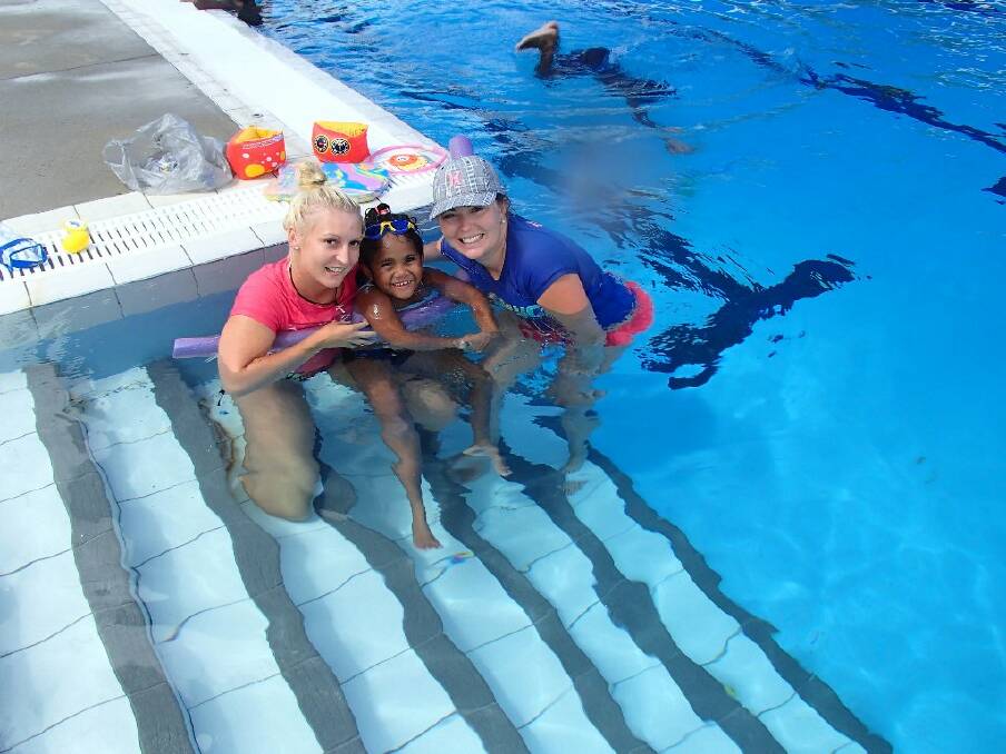 Tia Spencer and Kate Wylie teach Yarrabah locals the lifesaving skill of swimming.