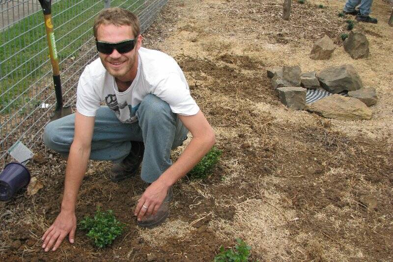 Michael Vinson getting his hands dirty in a horticulture course at Yass.