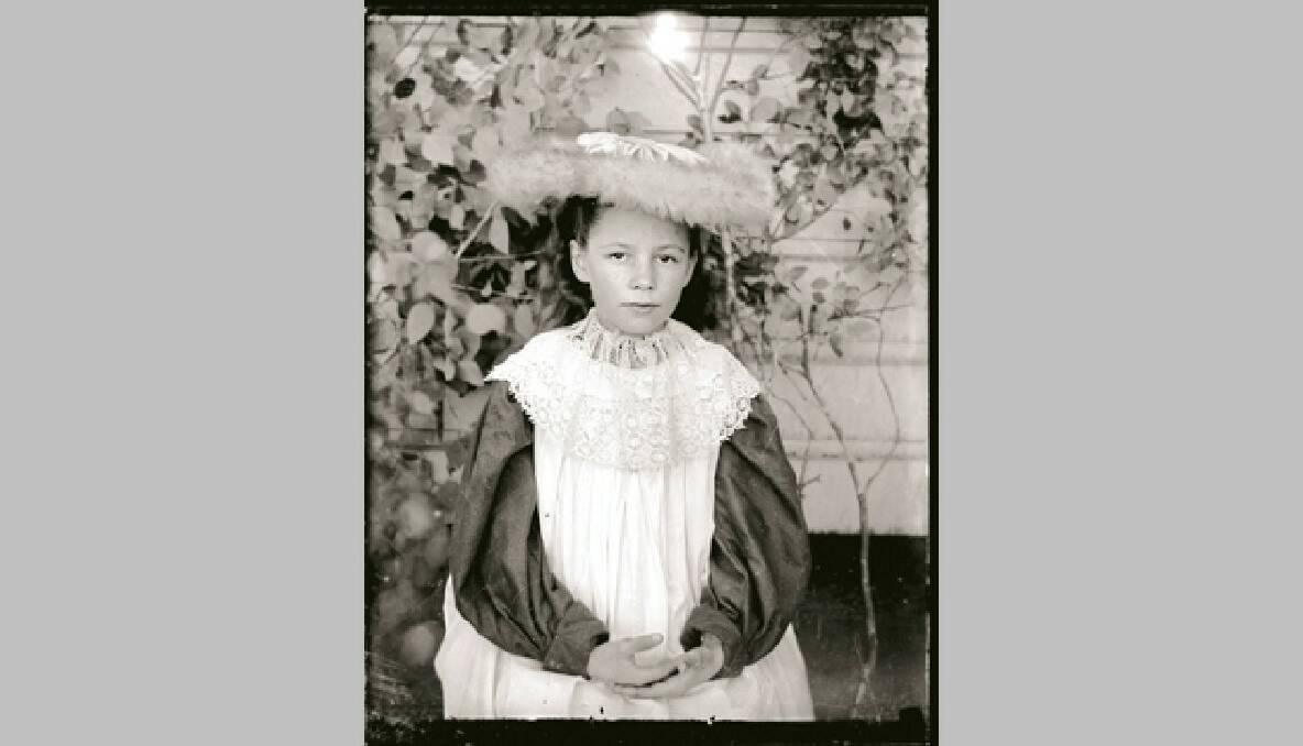 A young woman dressed in her finery. The owners of the photograph are hoping to track down her descendants.