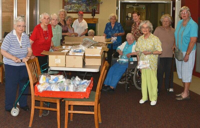 A group of Gwen Warmington Lodge residents helped package hand cream on Friday. Photo: Oliver Watson.